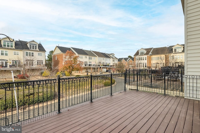 wooden terrace with a residential view