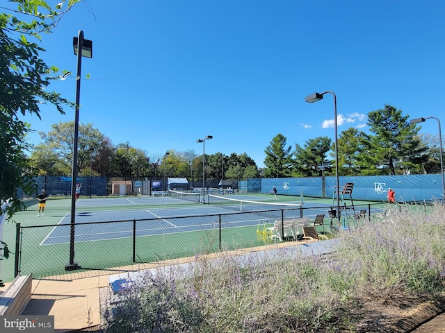 view of sport court with fence