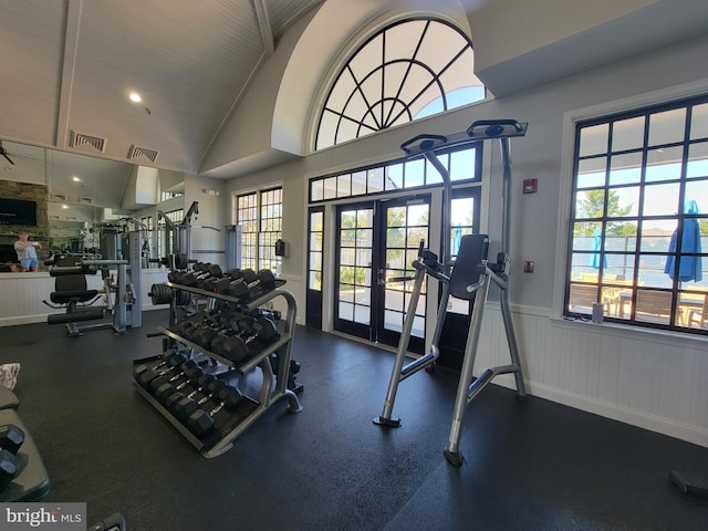 gym with plenty of natural light, wainscoting, and visible vents