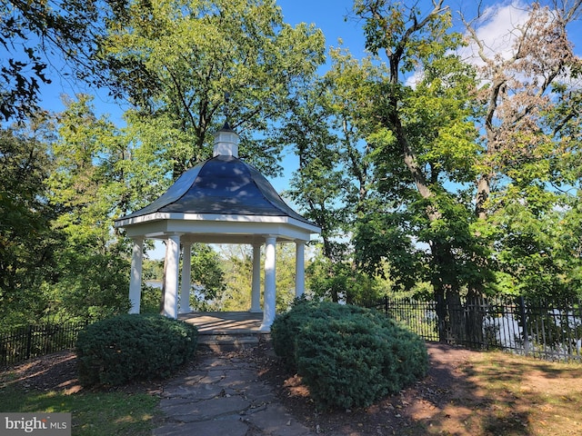 surrounding community featuring a gazebo and fence