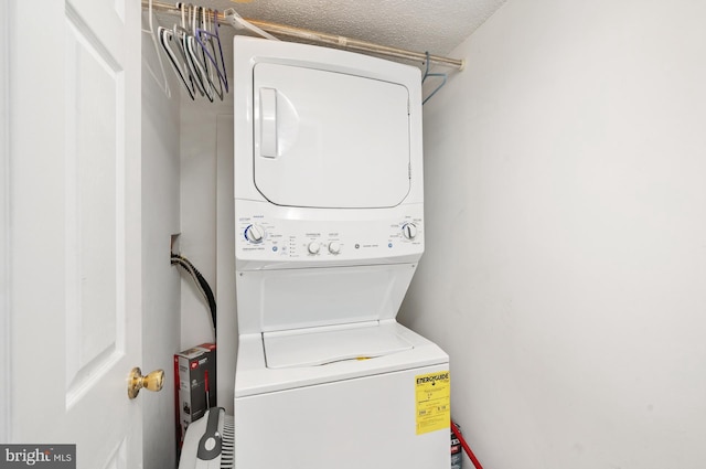 4711 Coastal Hwy Unit 441, Ocean City, MD 21842 - washroom featuring stacked washing maching and dryer and laundry area