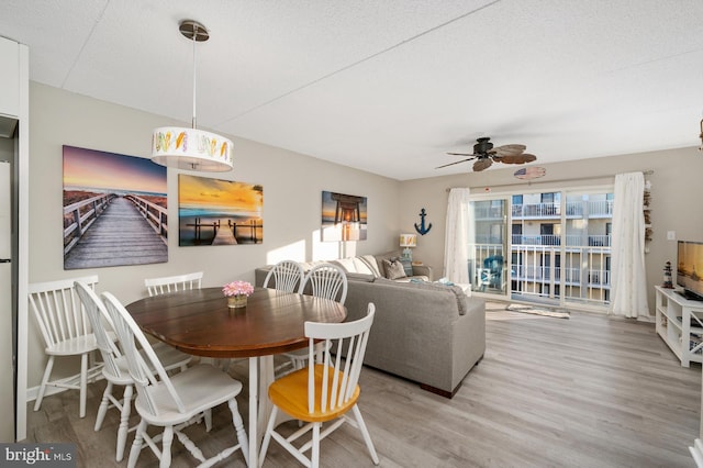 4711 Coastal Hwy Unit 441, Ocean City, MD 21842 - dining space featuring light wood-type flooring and ceiling fan