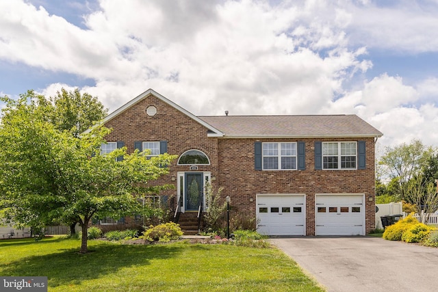 1232 Macedonia Church Rd, Stephens City, VA 22655 - view of front of home with driveway, brick siding, an attached garage, and a front yard