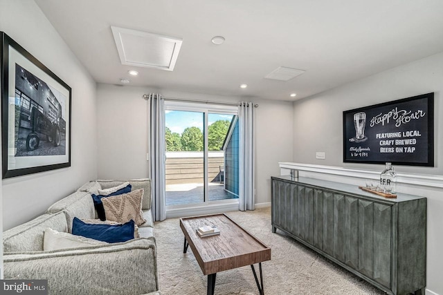 living room featuring recessed lighting, baseboards, and light carpet