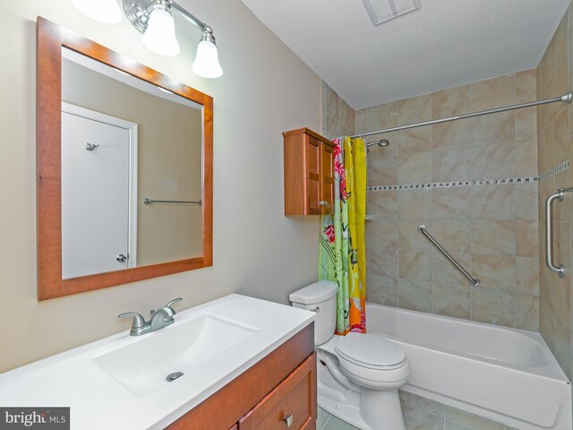full bathroom with visible vents, tile patterned flooring, vanity, toilet, and shower / bath combo with shower curtain