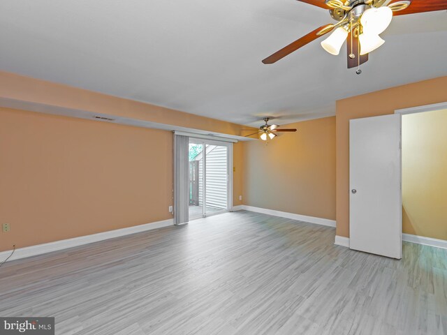 unfurnished room with a ceiling fan, baseboards, visible vents, and light wood-type flooring