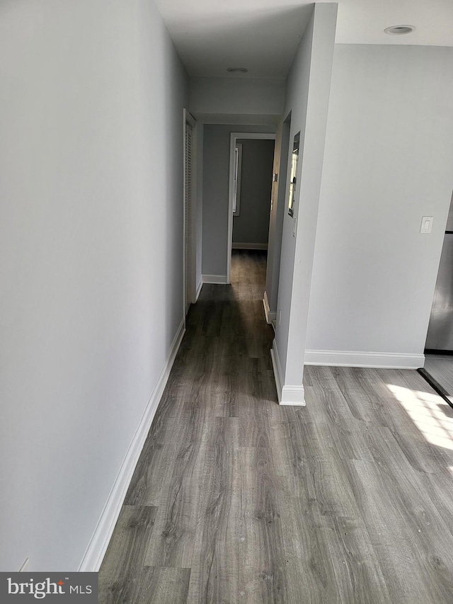4800 C St SE Unit 104, Washington, DC 20019 - hall with baseboards and wood finished floors