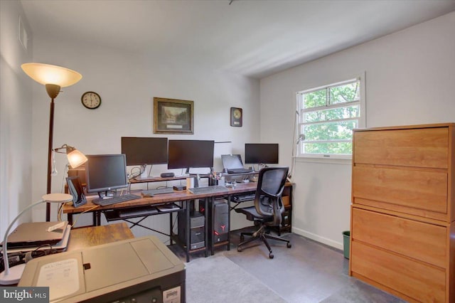 home office with baseboards and visible vents