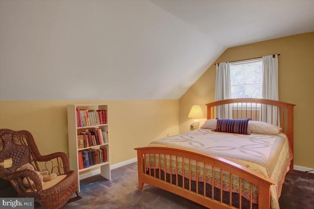 carpeted bedroom with baseboards and vaulted ceiling