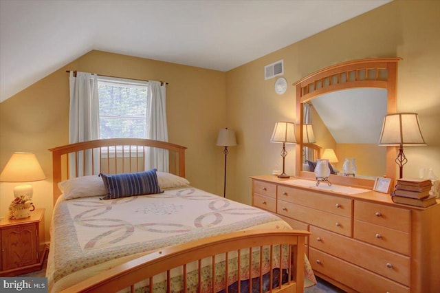 bedroom featuring visible vents and vaulted ceiling