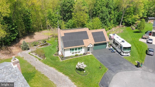aerial view featuring a wooded view