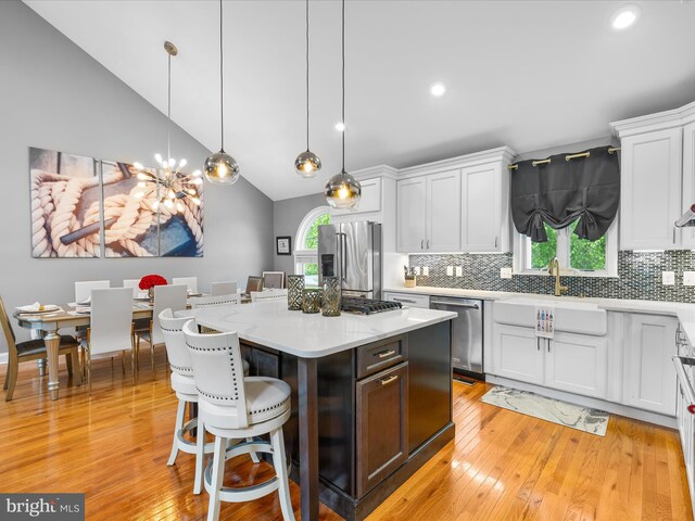 13295 Rollie Road E Rd, Bishopville, MD 21813 - kitchen with stainless steel appliances, a sink, white cabinets, decorative backsplash, and recessed lighting