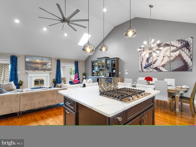 13295 Rollie Road E Rd, Bishopville, MD 21813 - kitchen featuring light wood-style flooring, a ceiling fan, high vaulted ceiling, open floor plan, and pendant lighting