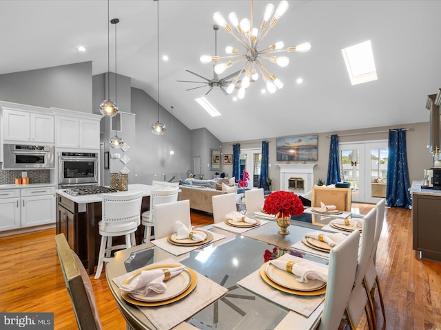 13295 Rollie Road E Rd, Bishopville, MD 21813 - dining room with a skylight, high vaulted ceiling, light wood finished floors, a chandelier, and ceiling fan