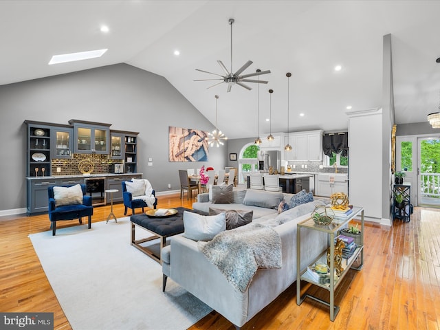 13295 Rollie Road E Rd, Bishopville, MD 21813 - living area with high vaulted ceiling, baseboards, a ceiling fan, light wood-type flooring, and recessed lighting