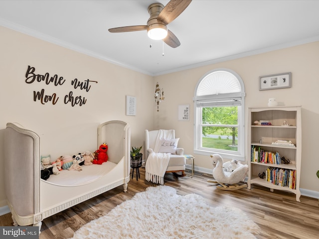 13295 Rollie Road E Rd, Bishopville, MD 21813 - bedroom with crown molding, wood finished floors, baseboards, and ceiling fan