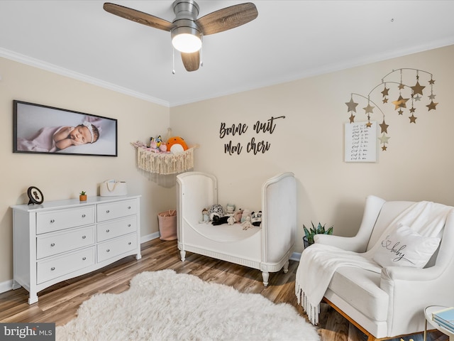 13295 Rollie Road E Rd, Bishopville, MD 21813 - bedroom with crown molding, wood finished floors, ceiling fan, and baseboards
