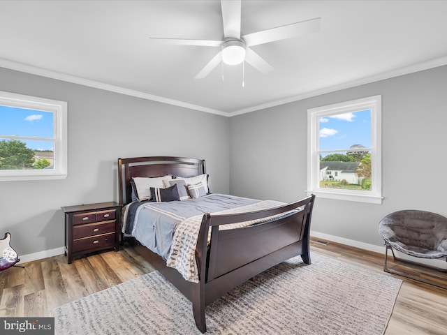 13295 Rollie Road E Rd, Bishopville, MD 21813 - bedroom featuring crown molding, wood finished floors, baseboards, and a ceiling fan