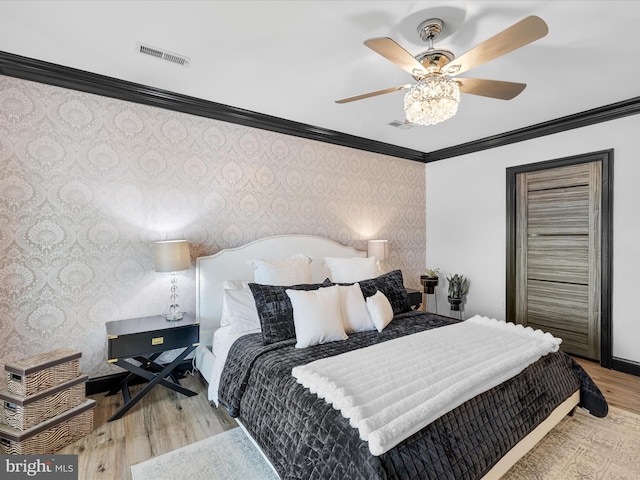 13295 Rollie Road E Rd, Bishopville, MD 21813 - bedroom with wallpapered walls, ornamental molding, wood finished floors, and a ceiling fan