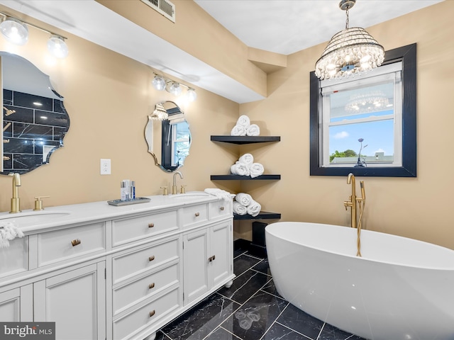 13295 Rollie Road E Rd, Bishopville, MD 21813 - bathroom with marble look tile flooring, a freestanding tub, double vanity, and a chandelier