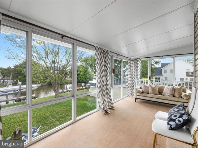 13295 Rollie Road E Rd, Bishopville, MD 21813 - sunroom / solarium featuring a water view, plenty of natural light, lofted ceiling, and expansive windows