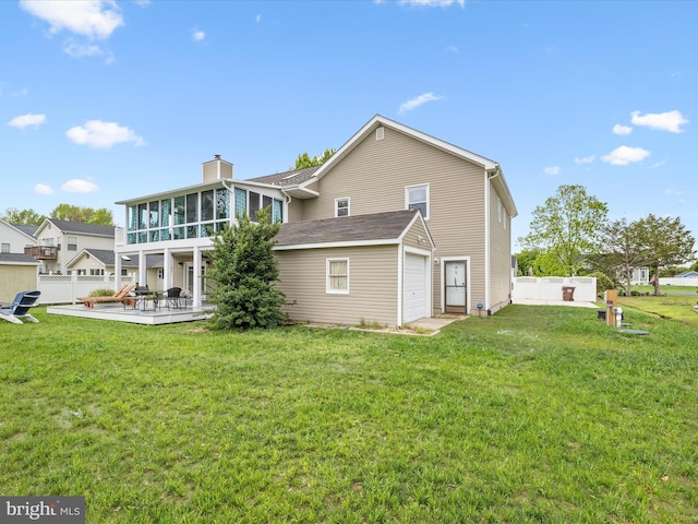 13295 Rollie Road E Rd, Bishopville, MD 21813 - back of property with a sunroom, a garage, and a chimney