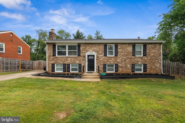 3208 Mulberry Ln, Temple Hills, MD 20748 - raised ranch featuring fence, brick siding, a chimney, and a front yard