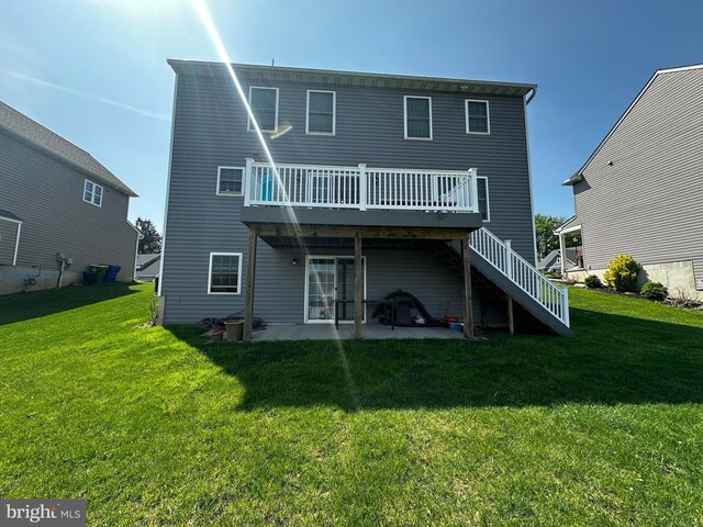 13 Verbena Dr, Lancaster, PA 17602 - back of property with a lawn, a wooden deck, stairway, and a patio