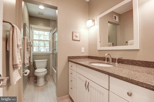 9504 Broome Ct, Vienna, VA 22182 - full bath featuring vanity, toilet, baseboards, and combined bath / shower with glass door