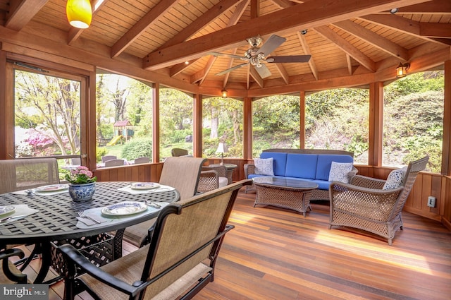 sunroom / solarium with an outdoor living space, a ceiling fan, beam ceiling, and outdoor dining space