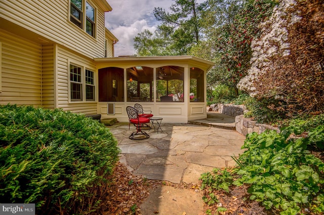 view of patio featuring a sunroom