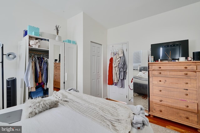 524 S Luzerne Ave, Baltimore, MD 21224 - bedroom with wood finished floors and multiple closets