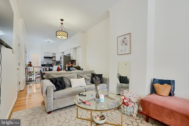 524 S Luzerne Ave, Baltimore, MD 21224 - living area with ornamental molding, light wood-type flooring, and baseboards