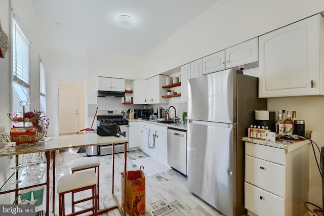 524 S Luzerne Ave, Baltimore, MD 21224 - kitchen featuring appliances with stainless steel finishes, open shelves, a sink, white cabinets, and ornamental molding