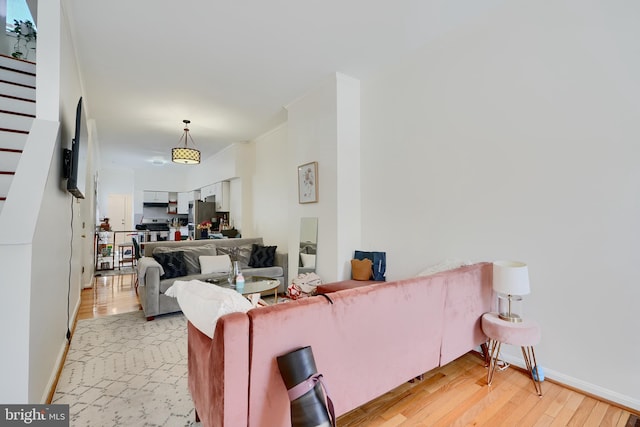524 S Luzerne Ave, Baltimore, MD 21224 - living room with light wood-type flooring and baseboards