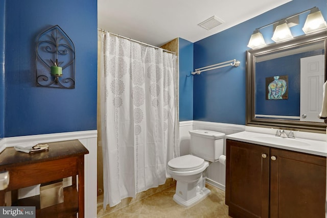 7228 Lensfield Ct, Alexandria, VA 22315 - full bath featuring wainscoting, vanity, tile patterned flooring, and a shower with curtain