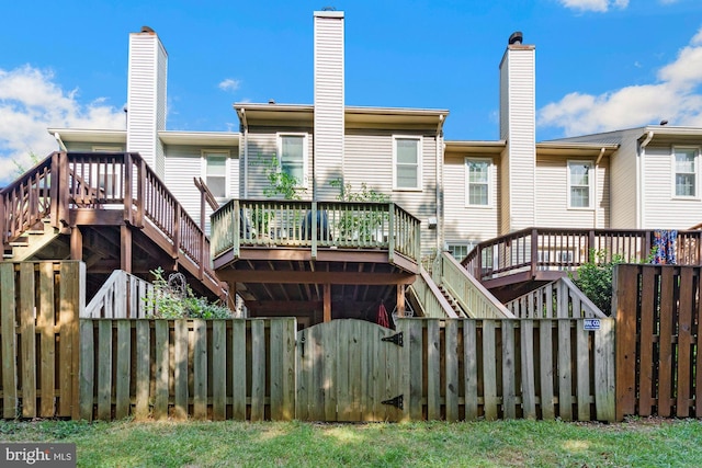 7228 Lensfield Ct, Alexandria, VA 22315 - rear view of house featuring stairway, a deck, and a chimney