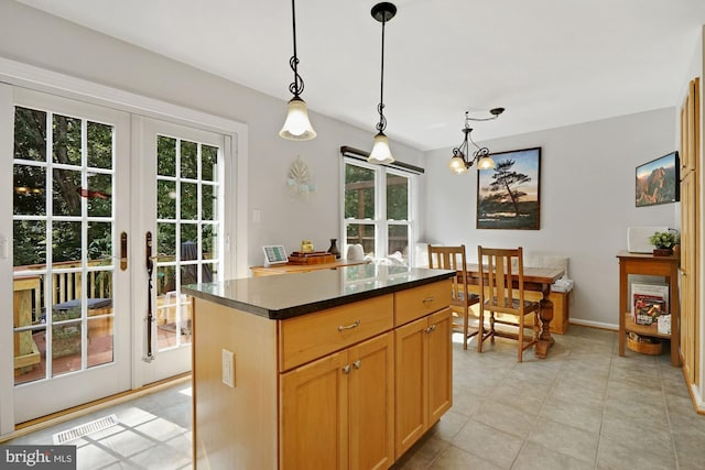 7228 Lensfield Ct, Alexandria, VA 22315 - kitchen with french doors, healthy amount of natural light, a chandelier, and dark countertops