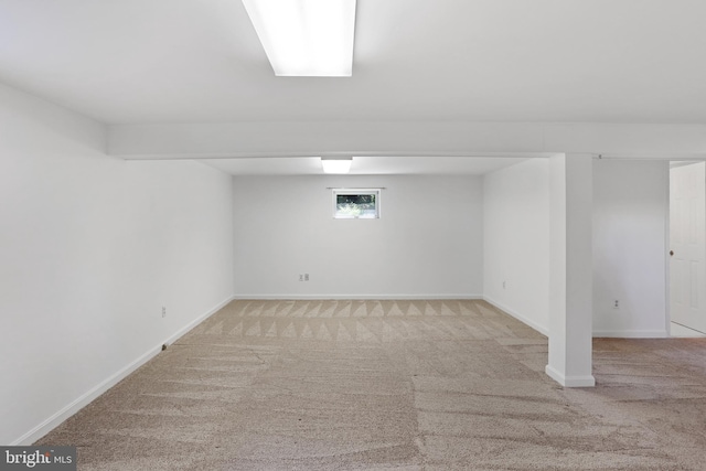 basement with carpet and baseboards