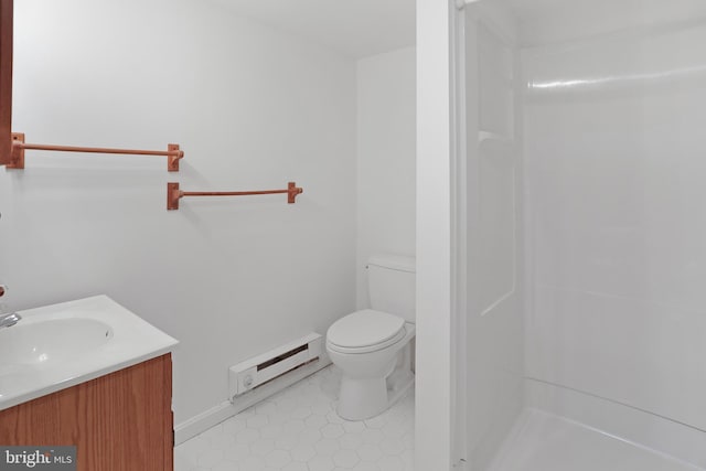 bathroom featuring baseboard heating, baseboards, toilet, vanity, and tile patterned flooring