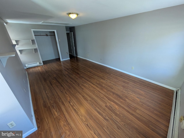 817 Ridge St, Easton, PA 18042 - unfurnished bedroom featuring a closet, baseboards, wood finished floors, and baseboard heating