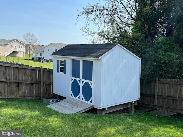 view of shed featuring a fenced backyard