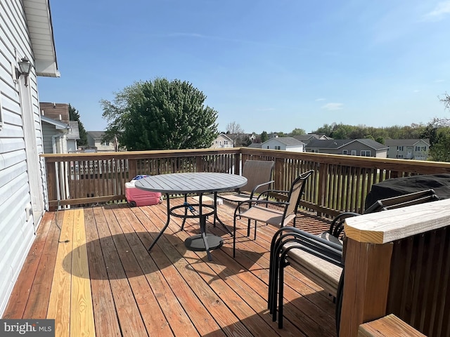 wooden terrace featuring a residential view