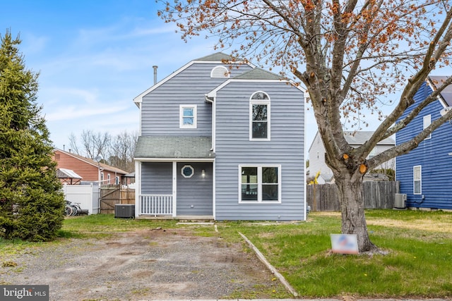 6 Plymouth Ter, Egg Harbor Township, NJ 08234 - view of front facade with fence, a front yard, and cooling unit