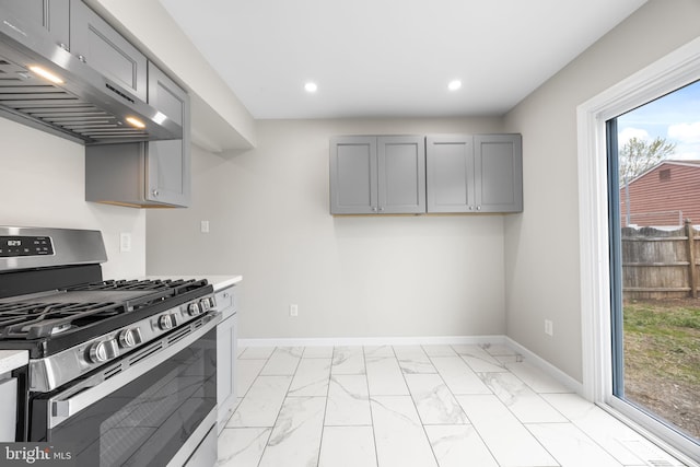 6 Plymouth Ter, Egg Harbor Township, NJ 08234 - kitchen with marble finish floor, stainless steel gas range oven, light countertops, gray cabinets, and under cabinet range hood