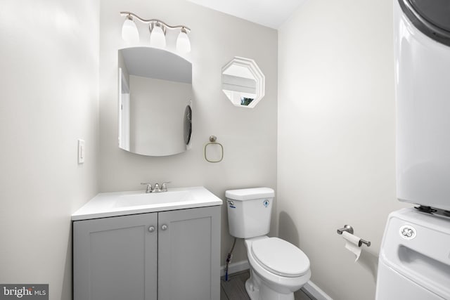 6 Plymouth Ter, Egg Harbor Township, NJ 08234 - half bathroom with vanity, baseboards, toilet, and washer / clothes dryer