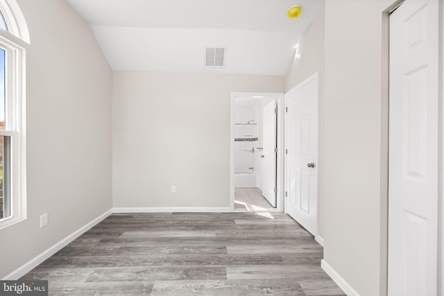 6 Plymouth Ter, Egg Harbor Township, NJ 08234 - unfurnished bedroom with visible vents, wood finished floors, baseboards, lofted ceiling, and ensuite bath