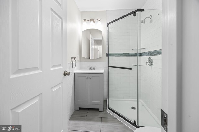 6 Plymouth Ter, Egg Harbor Township, NJ 08234 - bathroom featuring vanity, tile patterned flooring, and a shower stall