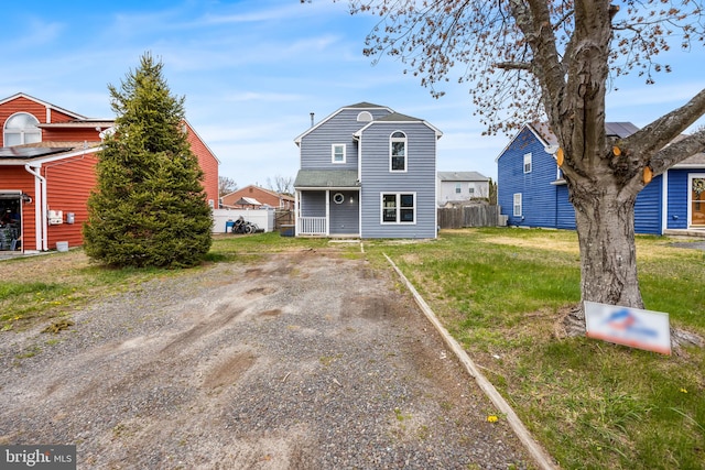 6 Plymouth Ter, Egg Harbor Township, NJ 08234 - view of front of home featuring fence, driveway, and a front lawn