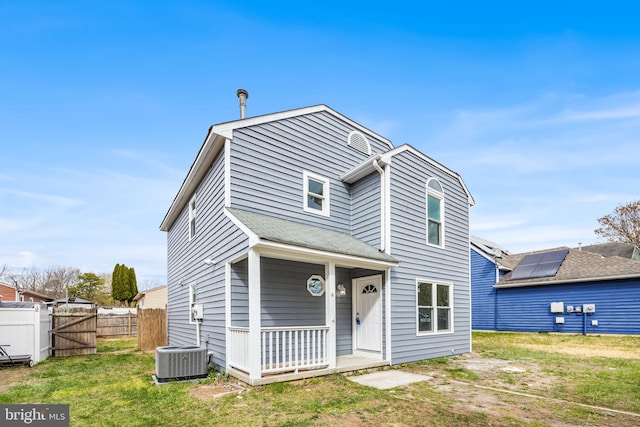 6 Plymouth Ter, Egg Harbor Township, NJ 08234 - view of front facade with fence, a front lawn, a porch, a gate, and cooling unit